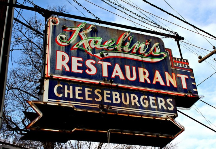 A sign hangs outside the old Kaelin's Restaurant in Louisville, KY, home to the first cheeseburger.